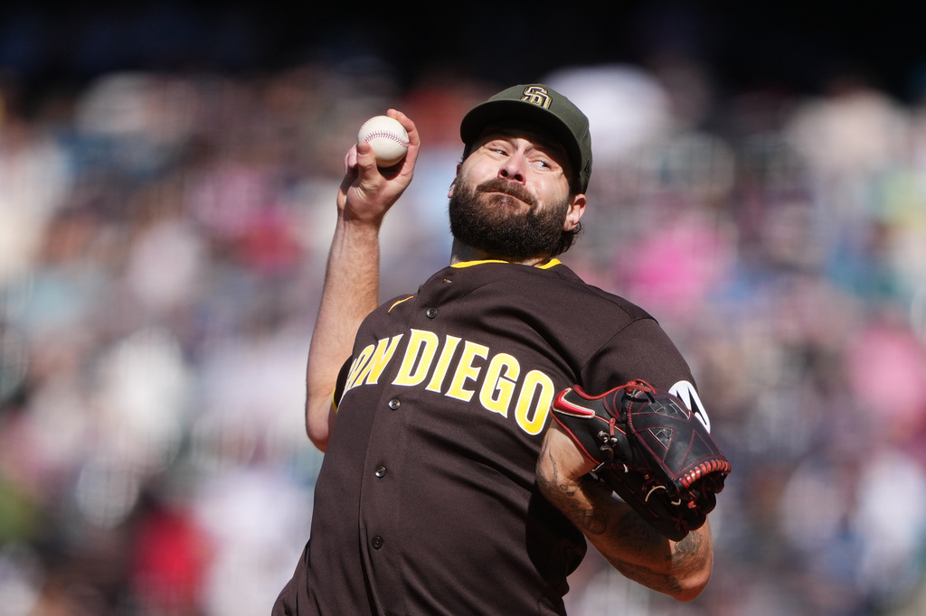 San Diego Padres starting pitcher Lucas Giolito throws against the Seattle Mariners during the first inning of a baseball game, Sunday, May 17, 2026, in Seattle. (AP Photo/Lindsey Wasson)