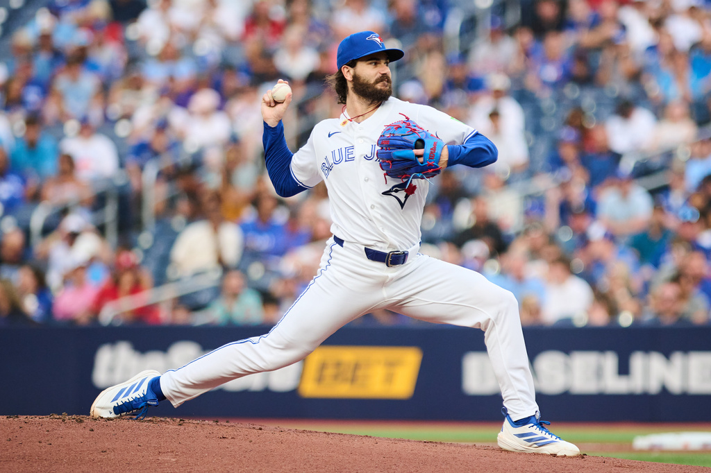 Toronto Blue Jays' Dylan Cease (84) pitches against the Boston Red Sox during the first inning of a baseball game in Toronto, Tuesday, Aug. 11, 2026. (Sammy Kogan/The Canadian Press via AP)