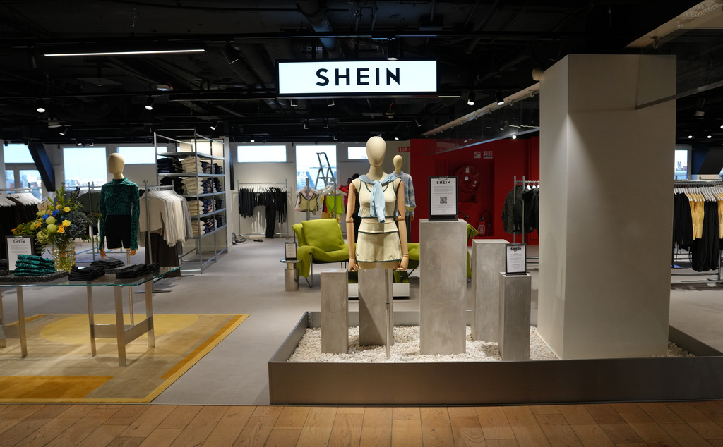 Clothes by Chinese company Shein are seen in the BHV (Bazar de l'Hotel de Ville) general store, ahead of the Shein stand opening, Tuesday, Nov. 4, 2025 in Paris. (AP Photo/Aurelien Morissard)