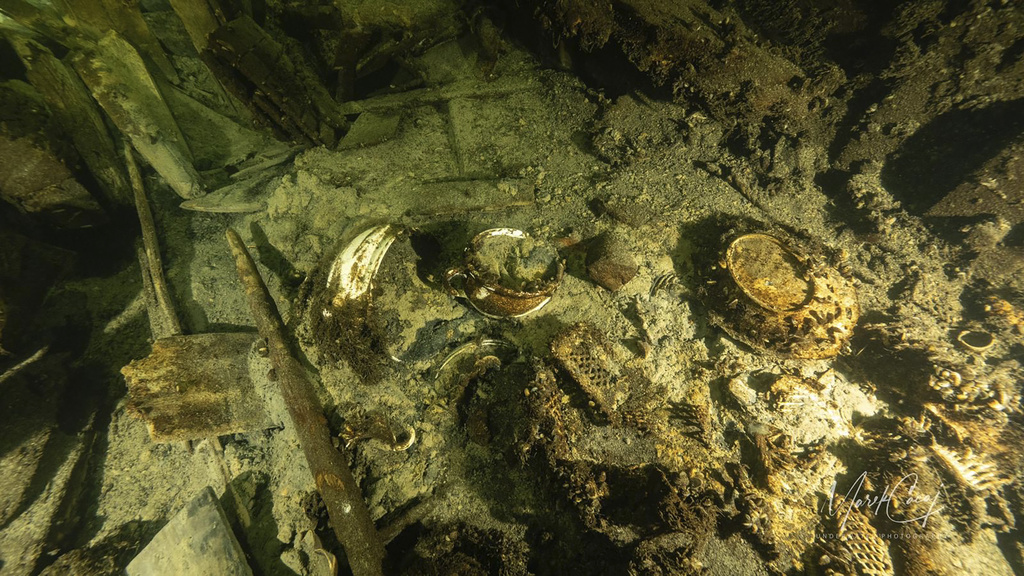 Porcelain items in a 19th century sailing ship wreckage that a team of Polish divers discovered on July 11, 2024, on the Baltic seabed about 37 kilometers (20 nautical miles) south of the Swedish isle of &Ouml;land. The ship was loaded &quot;to the brim&quot; with luxury goods including porcelain items and about 100 bottles of Champagne and mineral water and rests about 58 meters (190 feet) deep in conditions that the Baltictech divers say have preserved it &quot;wonderfully.&quot; (Tomasz Stachura/Baltictech via AP)