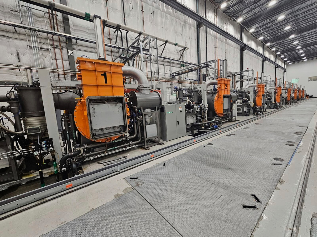 This photo provided by Noveon Magnetics, a row of specialized furnaces that are used to produce rare earth magnets sits inside the Noveon Magnetics plant in San Marcos, Texas. (Noveon Magnetics via AP)