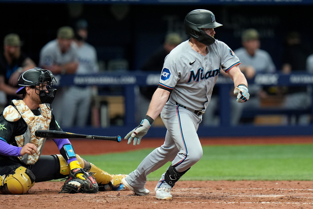 Miami Marlins' Liam Hicks watches his two-run single off Tampa Bay Rays pitcher Hunter Bigge during the 10th inning of a baseball game Saturday, May 16, 2026, in St. Petersburg, Fla. (AP Photo/Chris O'Meara)