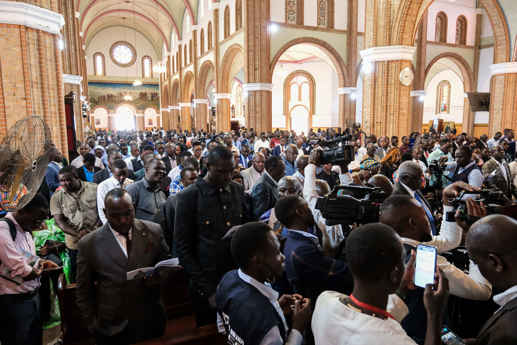 Supporters of detained Ugandan opposition figure Kizza Besigye gather for a prayer to press authorities to free him at Rubaga Cathedral in Kampala, Monday, Feb. 23, 2026. (AP Photo/Hajarah Nalwadda)