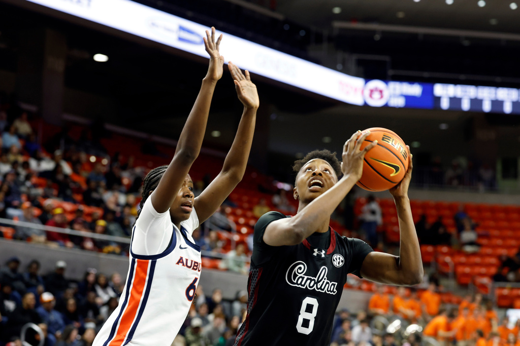 South Carolina forward Joyce Edwards (8) looks to shoot around Auburn forward Khady Leye (6) during the first period of an NCAA college basketball game Thursday, Jan. 29, 2026, in Auburn, Ala. (AP Photo/Butch Dill)