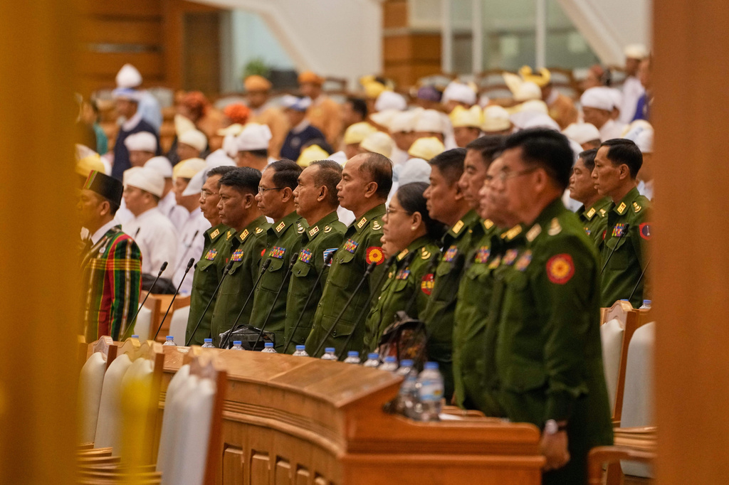 Myanmar's military representatives stay stand as Parliament chairman Aung Lin Dwe, unseen, leaves after a session at Union Parliament in Naypyitaw, Myanmar, Thursday, April 9, 2026. (AP Photo/Aung Shine Oo)