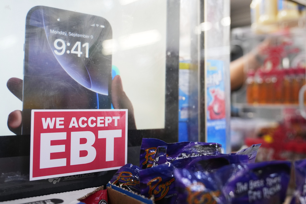FILE - A sign is displayed for EBT for the USDA Supplemental Nutrition Assistance Program (SNAP) at the Friend's Meat Market and Grocery, Friday, Nov. 14, 2025, in Miami. (AP Photo/Lynne Sladky, File)