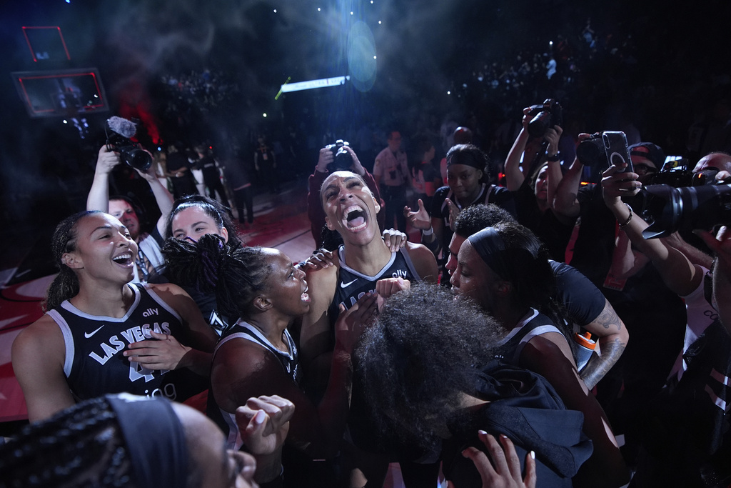 Las Vegas Aces center A'ja Wilson, center, celebrates with teammates after defeating the Seattle Storm in Game 3 in the first round of the WNBA basketball playoffs Thursday, Sept. 18, 2025, in Las Vegas. (AP Photo/John Locher)