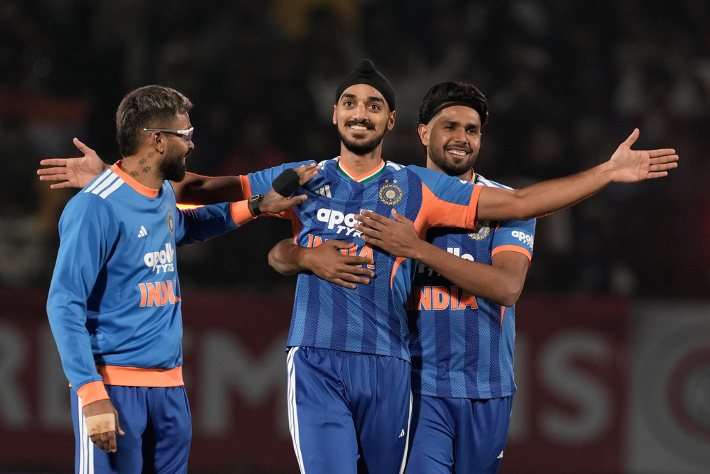 India's Arshdeep Singh, center, celebrates with teammates the wicket of South Africa's Reeza Hendricks during the third T20 cricket match between India and South Africa in Dharamshala, India, Sunday, Dec. 14, 2025. (AP Photo/Ashwini Bhatia)
