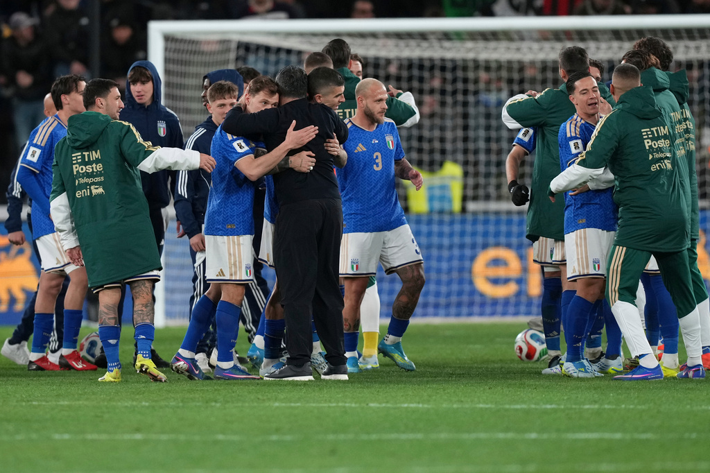 Italian and Northern Ireland players react after the World Cup qualifying play-off soccer match between Italy and Northern Ireland, in Bergamo, Italy, Thursday, March 26, 2026. (AP Photo/Antonio Calanni)