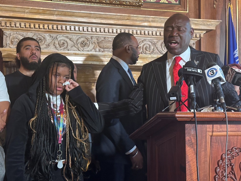Kah'liyah Aliomar, the daughter of Corey Ruiz, who was shot and killed by a Madison police officer, wipes away tears as attorney Ben Crump speaks at a news conference on Friday, July 24, 2026, in Madison, Wis. (AP Photo/Scott Bauer)