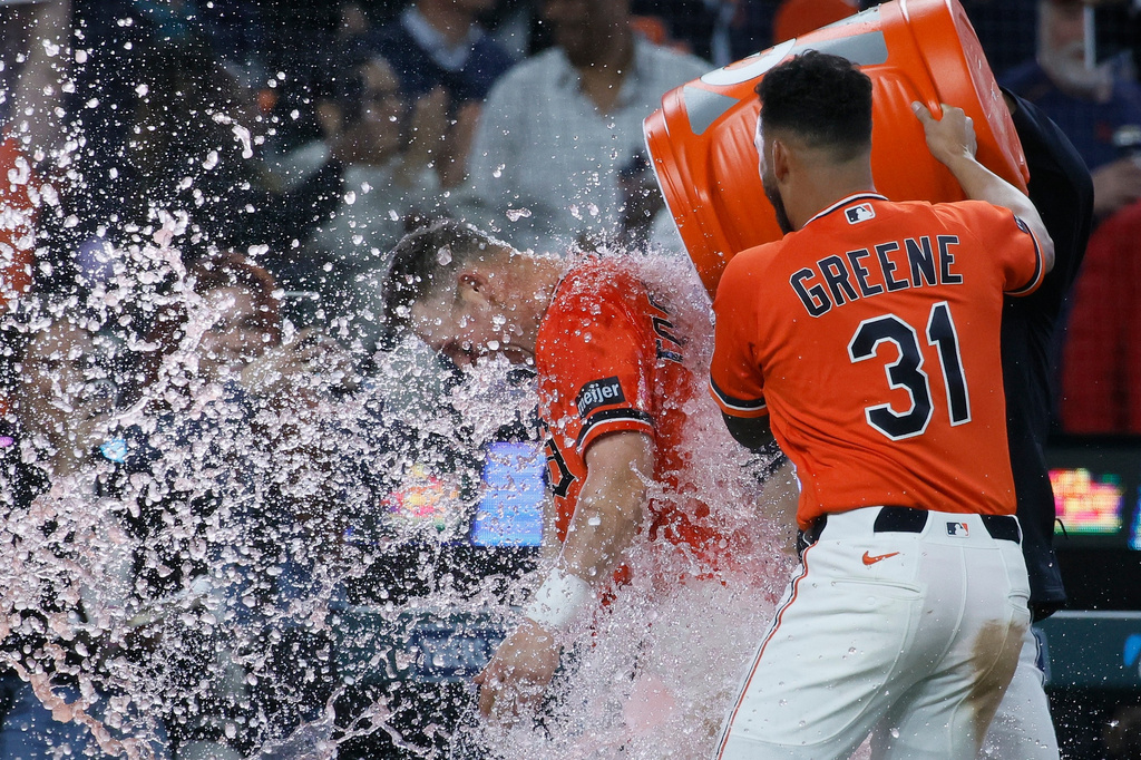 Detroit Tigers' Spencer Torkelson, left, is doused with water by Riley Greene (31) after hitting an RBI single to drive in Matt Vierling in the bottom of the ninth inning to defeat the Toronto Blue Jays in a baseball game Friday, May 15, 2026, in Detroit. (AP Photo/Duane Burleson)