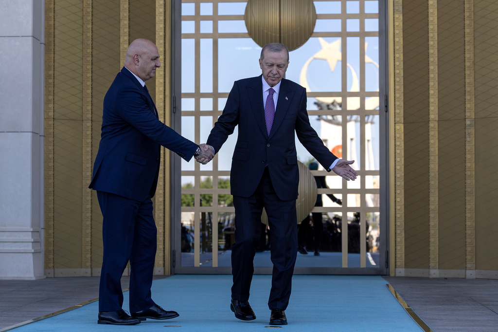 Turkish President Recep Tayyip Erdogan, right, shakes hands with his Lebanese counterpart Joseph Aoun before their meeting at the presidential palace in Ankara, Thursday, July 30, 2026. (Ugur Yildirim/DIA Photo via AP)