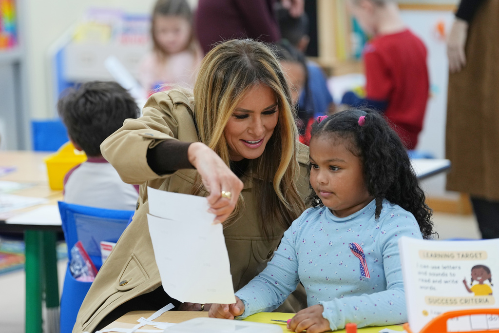 First lady Melania Trump meets with students at DeLalio Elementary School on the Marine Corps Air Station New River in Jacksonville, N.C., Wednesday, Nov. 19, 2025. (AP Photo/Matt Rourke)