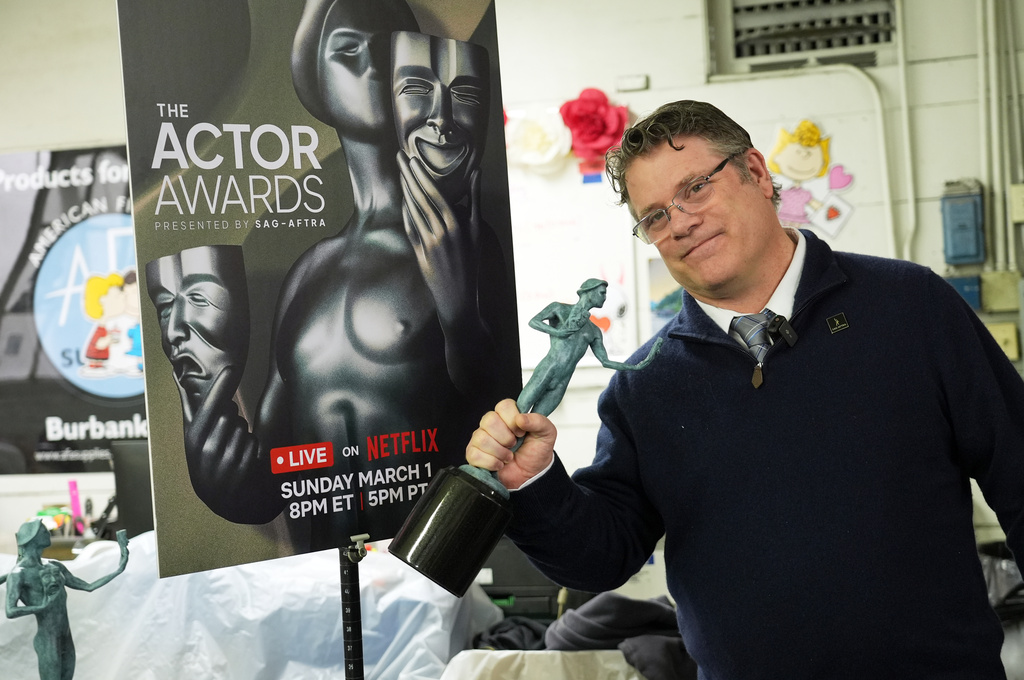 SAG-AFTRA president Sean Astin shows off a finished solid bronze Actor statuette during the 32nd Actor Awards statuette pouring event presented by SAG-AFTRA on Thursday, Feb. 5, 2026, at American Fine Arts Foundry in Burbank, Calif. (AP Photo/Chris Pizzello)