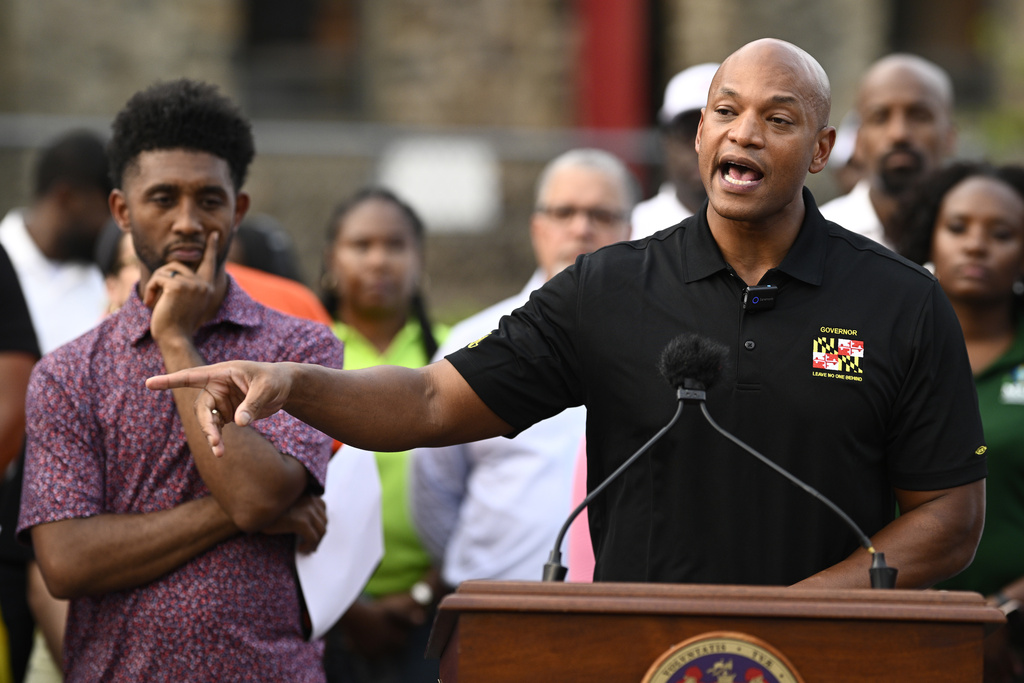 Maryland Gov. Wes Moore, right, speaks next to Baltimore mayor Brandon Scott, left, during a news conference, Friday, Sept. 5, 2025, in Baltimore. (AP Photo/Nick Wass)