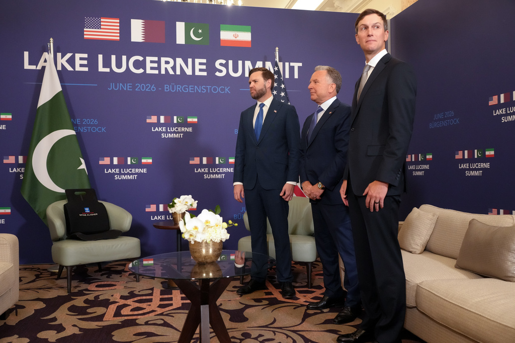 U.S. Vice President JD Vance waits, alongside U.S. President Donald Trump's envoys Steve Witkoff, second right, and Jared Kushner, right, to meet with Pakistan's Prime Minister Shehbaz Sharif for high-level talks aimed at advancing a deal to end the Middle East conflict, at the Bürgenstock Resort in Obbuergen, near Lucerne, in Switzerland, Sunday, June 21, 2026. (Nathan Howard/Pool Photo via AP)