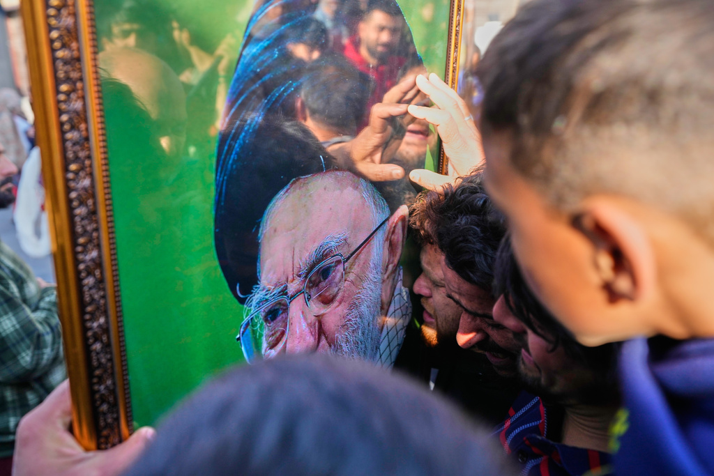 Shiite Muslims mourn the killing of Iranian Supreme Leader Ayatollah Ali Khamenei during a protest against the U.S. and Israel in Srinagar, Indian controlled Kashmir, Sunday, March 1, 2026. (AP Photo/Mukhtar Khan)