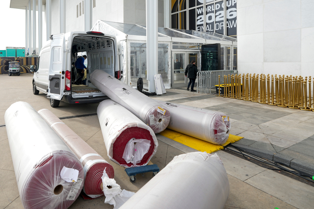 The red carpet is delivered prior to the final draw for the 2026 soccer World Cup at the Kennedy Center in Washington, Thursday, Dec. 4, 2025. (AP Photo/Chris Carlson)