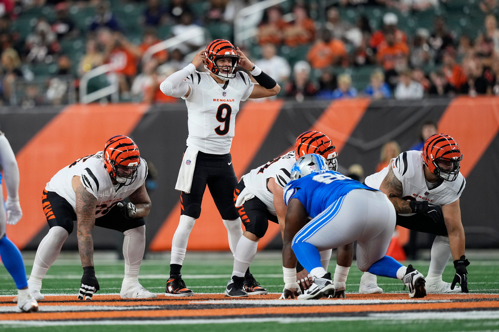 Cincinnati Bengals quarterback Joe Burrow (9) signals at the line of scrimmage against the Detroit Lions during the first half of a preseason NFL football game Thursday, Aug. 13, 2026, in Cincinnati. (AP Photo/Carolyn Kaster))