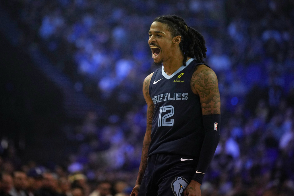 Memphis Grizzlies guard Ja Morant reacts during the second half of an NBA basketball game against the Orlando Magic Sunday, Jan. 18, 2026, in London. (AP Photo/Kin Cheung)