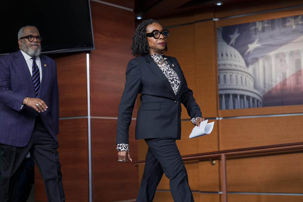 Rep. Yvette Clarke, D-N.Y., center, followed by Rep. Troy Carter, D-La., left, as members of the Congressional Black Caucus speak to reporters in the wake of the Supreme Court ruling to strike down a majority Black congressional district in Louisiana, at the Capitol in Washington, Wednesday, April 29, 2026. (AP Photo/J. Scott Applewhite)