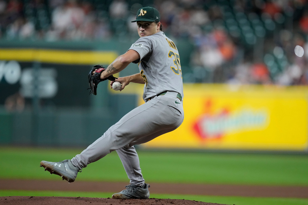 Athletics pitcher J.T. Ginn delivers during the first inning of a baseball game against the Houston Astros, Friday, Aug. 21, 2026, in Houston. (AP Photo/Kevin M. Cox)