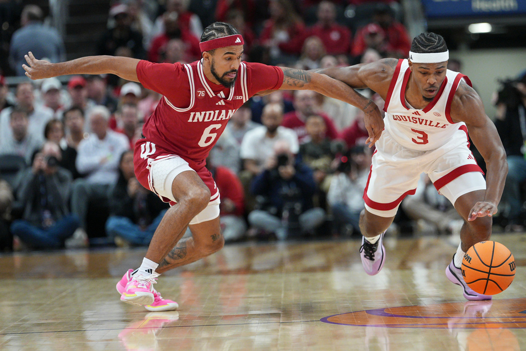 Indiana guard Tayton Conerway (6) gets the ball stolen from him by Louisville guard Ryan Conwell (3) during an NCAA college basketball game in Indianapolis, Saturday, Dec. 6, 2025. (AP Photo/AJ Mast)