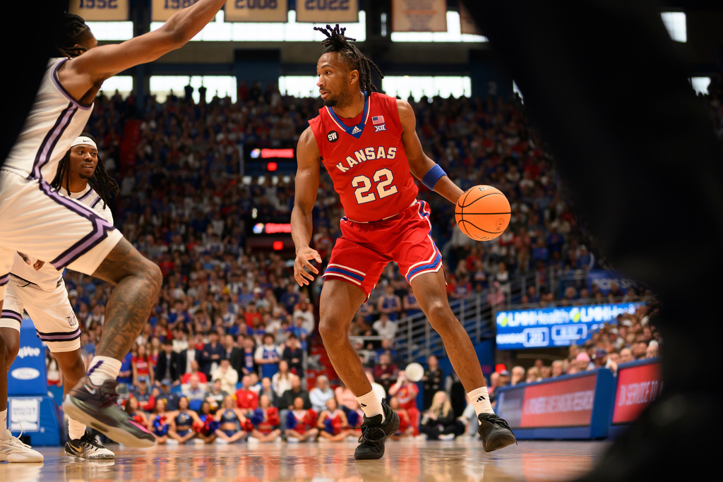 Kansas guard Darryn Peterson (22) brings the ball upcourt against Kansas State during the first half of an NCAA college basketball game in Lawrence, Kan., Saturday, March 7, 2026. (AP Photo/Reed Hoffmann)