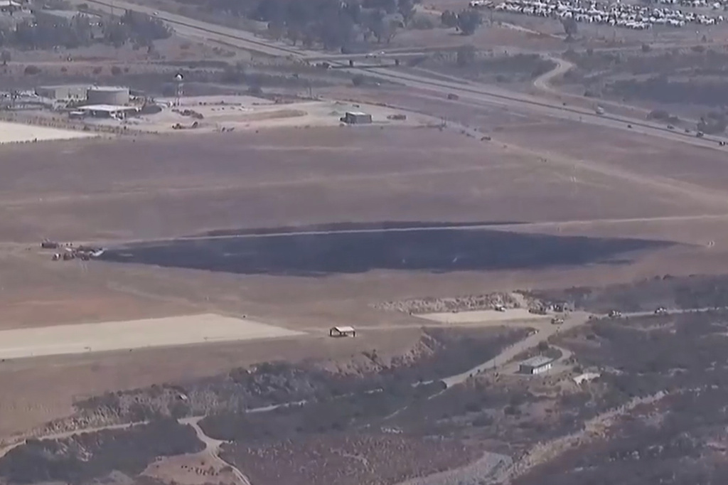 This image made from a video provided by KGTV shows the scene of an F-35 jet crash Friday, July 31, 2026, near the Miramar Air Base in San Diego. (KGTV via AP)