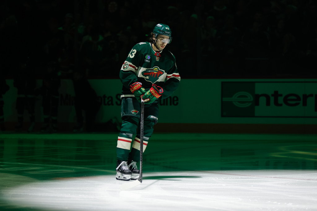 Minnesota Wild defenseman Quinn Hughes skates on the ice before an NHL hockey game against the Boston Bruins, Sunday, Dec. 14, 2025, in St. Paul, Minn. (AP Photo/Bailey Hillesheim)