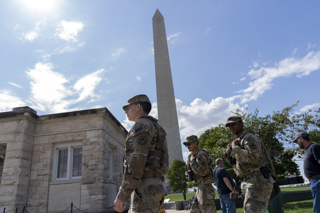 Members of the Louisiana National Guard patrol the National Mall Sunday, Sept. 7, 2025, in Washington. (AP Photo/Jose Luis Magana)