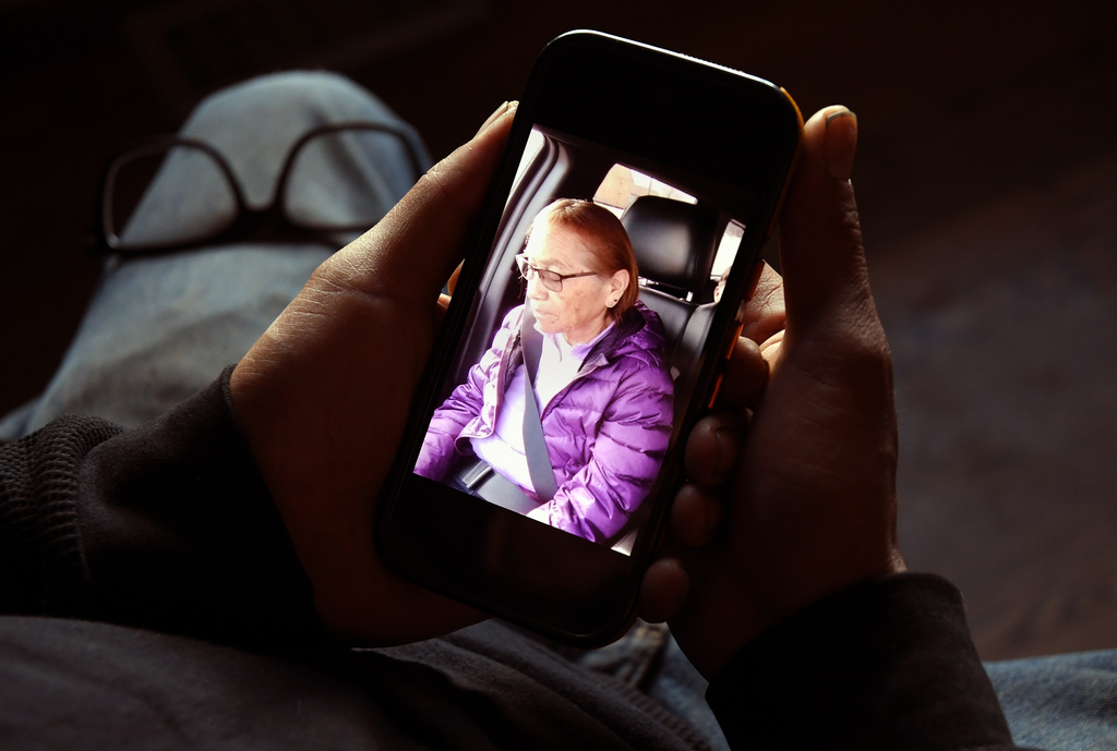 Gerald Begay, whose mother Ella Mae Begay went missing from her home, shows a photo of her on his phone in Denver, Thursday, April 2, 2026. (AP Photo/Thomas Peipert)