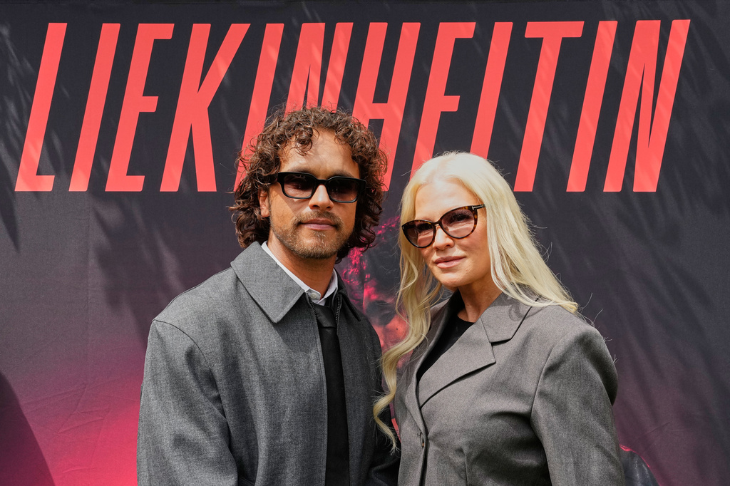 Linda Lampenius and Pete Parkkonen, who compete as Liekinheitin for Finland at the 70th Eurovision Song Contest, watch the camera after an interview with The Associated Press in Vienna, Austria, Thursday, May 14, 2026. (AP Photo/Martin Meissner)