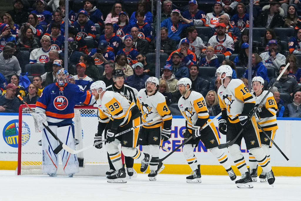 New York Islanders goaltender Ilya Sorokin (30), watches as Pittsburgh Penguins' Anthony Mantha (39) skates past him with teammates after Mantha scored a goal during the second period of an NHL hockey game Monday, March 30, 2026, in Elmont, N.Y. (AP Photo/Frank Franklin II)