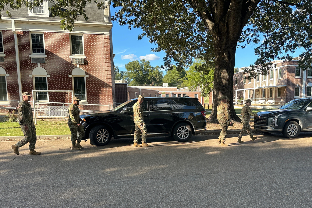 National Guard soldiers leave the Shelby County Office of Preparedness in Memphis, Tenn., Wednesday, Oct. 1, 2025. (AP Photo/Adrian Sainz)