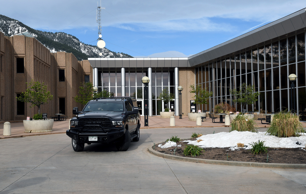 A law enforcement vehicle is parked outside of the Boulder County Justice Center in Boulder, Colo., on Thursday, May 7, 2026. (AP Photo/Thomas Peipert)