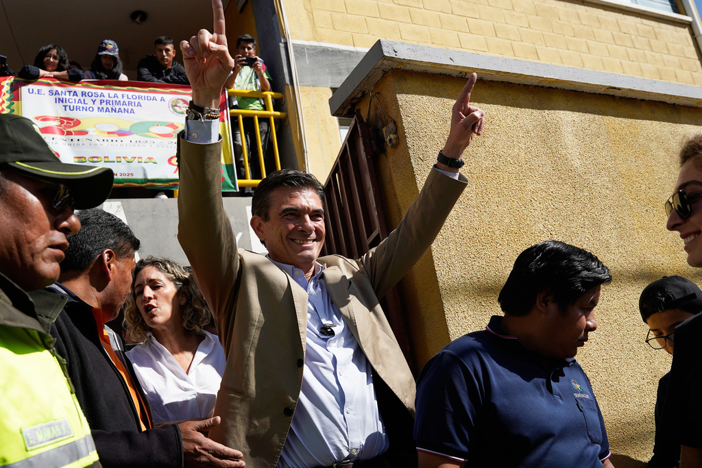 Presidential candidate Rodrigo Paz leaves after accompanying his daughter Catalina to vote during general elections, in La Paz, Bolivia, Sunday, Aug. 17, 2025. (AP Photo/Freddy Barragan)