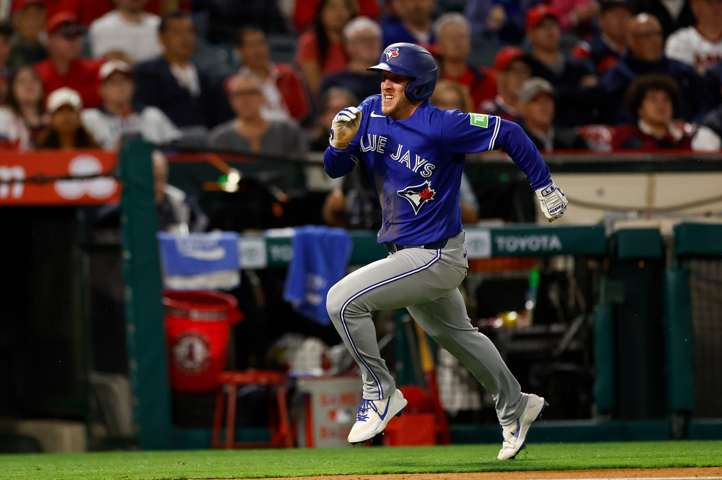 Toronto Blue Jays' Myles Straw (3) runs to home plate to score during the seventh inning of a baseball game against the Los Angeles Angels, Monday, April 20, 2026, in Anaheim, Calif. (AP Photo/Caroline Brehman)