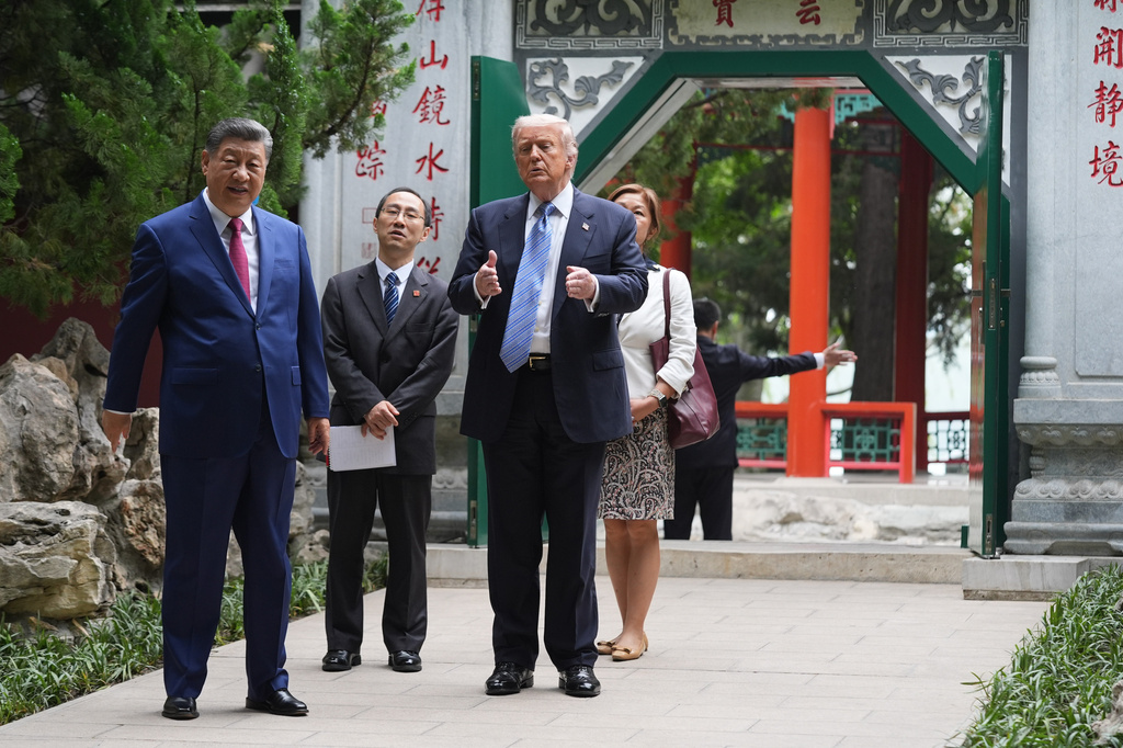 President Donald Trump walks with China's President Xi Jinping at the Zhongnanhai leadership compound, Friday, May 15, 2026, in Beijing. (AP Photo/Mark Schiefelbein, Pool)