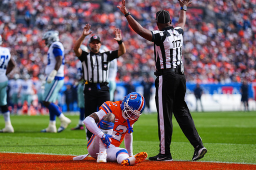 Denver Broncos cornerback Pat Surtain II sits on the field with an unknown injury as officials call time in the irst half of an NFL football game against the Dallas Cowboys Sunday, Oct. 26, 2025, in Denver. (AP Photo/Jack Dempsey) Denver Broncos cornerback Pat Surtain II sits on the field with an unknown injury as officials call time in the irst half of an NFL football game against the Dallas Cowboys Sunday, Oct. 26, 2025, in Denver. (AP Photo/Jack Dempsey)