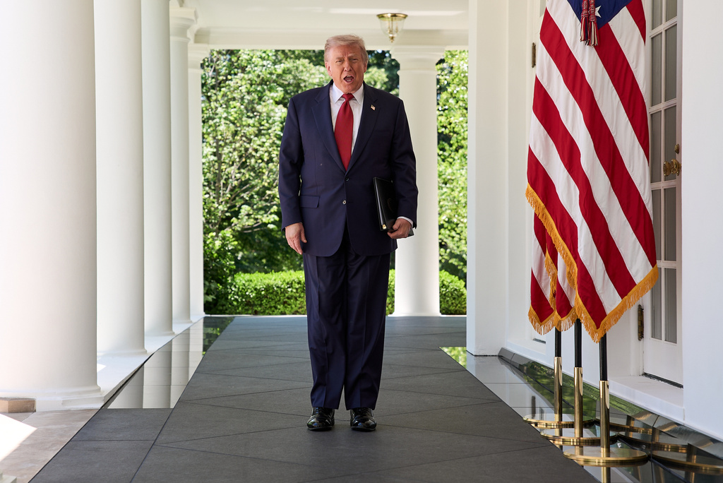 President Donald Trump walks through the Colonnade of the White House as he arrives to attend a luncheon for mothers Friday, May 8, 2026, in the Rose Garden of the White House, in Washington. (AP Photo/Jacquelyn Martin)