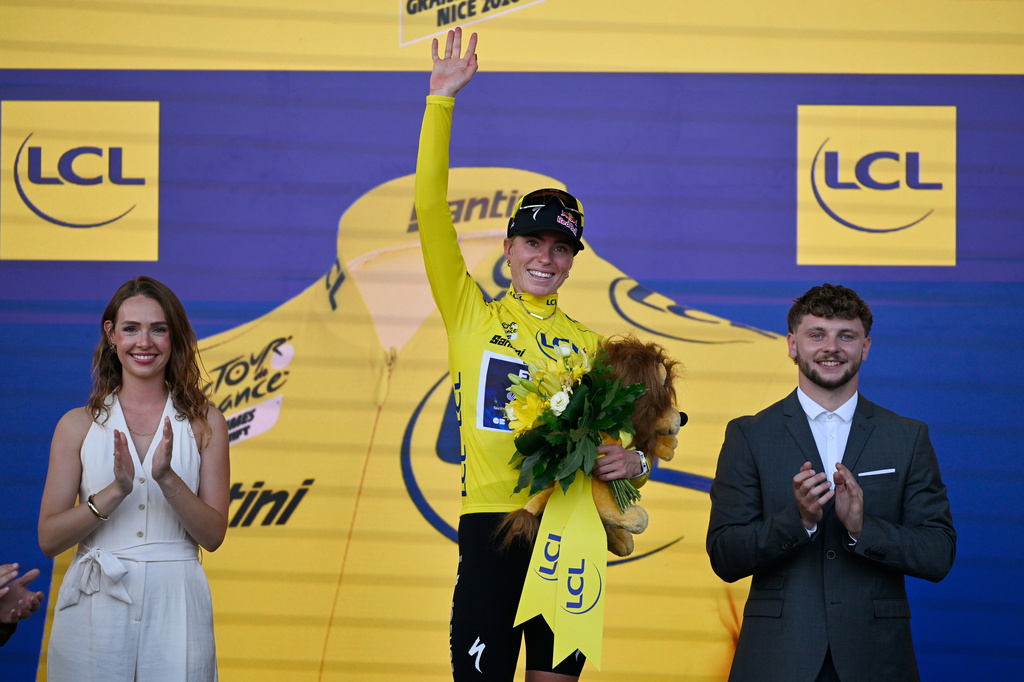Netherlands' Demi Vollering celebrates on the podium after winning the Women's Tour de France cycling race (Tour de France Femmes) in Nice, France, Sunday, Aug. 9, 2026. (AP Photo/Philippe Magoni)