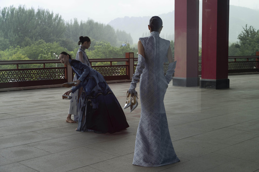 Models prepare for the Misuity SS2026 China Fashion Week opening show held on the outskirts of Beijing, China, Friday, Sept. 5, 2025. (AP Photo/Ng Han Guan) Models prepare for the Misuity SS2026 China Fashion Week opening show held on the outskirts of Beijing, China, Friday, Sept. 5, 2025. (AP Photo/Ng Han Guan)