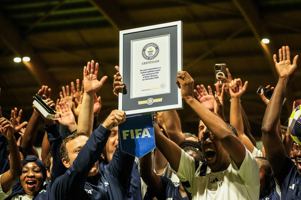People celebrate after breaking the Guinness World Record for most nationalities in an exhibition soccer match organized by FIFA, in Rabat, Morocco, Wednesday, Nov. 5, 2025. (AP Photo/Mosa'ab Elshamy)