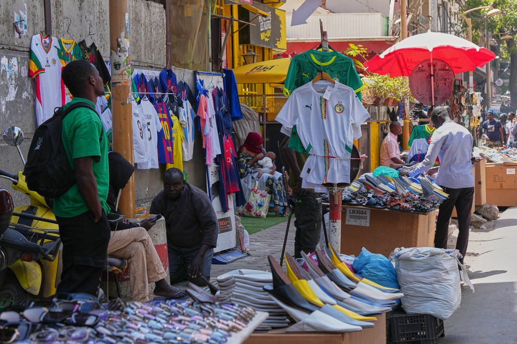 A roadside shop displays Senegal national team shirts in Dakar, Senegal, Wednesday, March 18, 2026. (AP Photo/Misper Apawu)