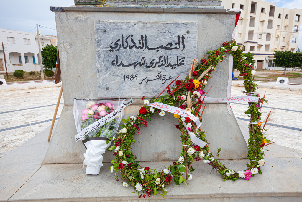 Demonstrators gather at a memorial site honoring the victims of the 1985 Israeli attack on Palestine Liberation Organization's headquarters, in Hammam Chott outside Tunisia's capital, Wednesday, Oct. 1, 2025. (AP Photo/Ons Abid)