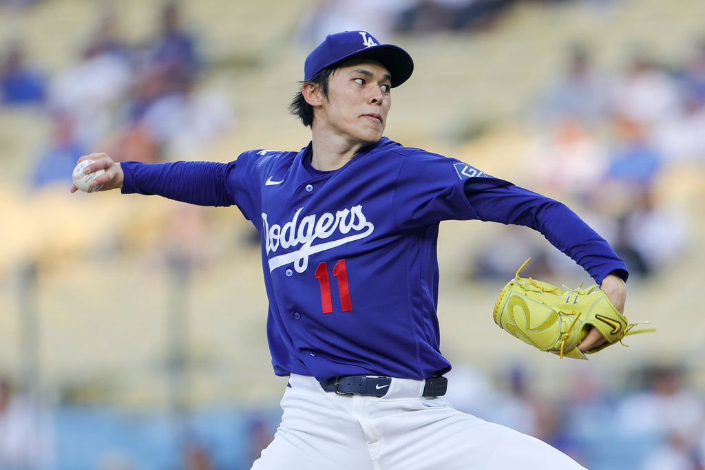 Los Angeles Dodgers starting pitcher Roki Sasaki throws during the first inning of a spring training baseball game against the Los Angeles Angels, Monday, March 23, 2026, in Los Angeles. (AP Photo/Ryan Sun)