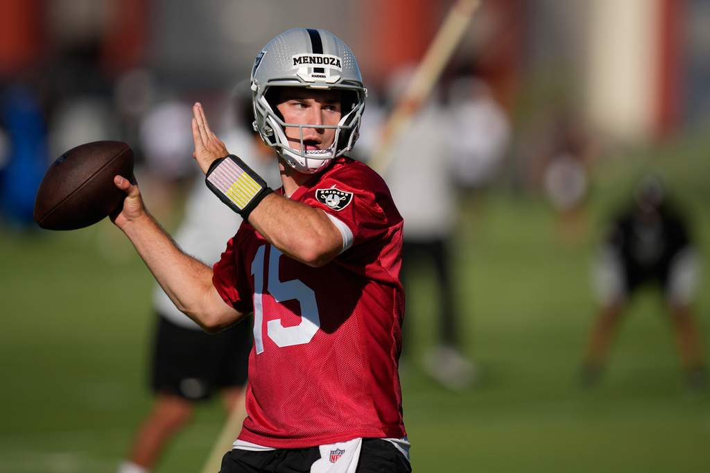 FILE - Las Vegas Raiders quarterback Fernando Mendoza throws during the NFL football team's practice Wednesday, June 10, 2026, in Henderson, Nev. (AP Photo/John Locher)