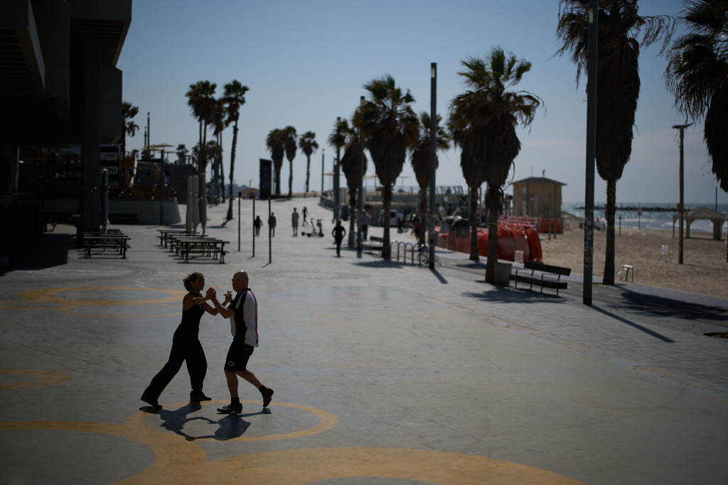 Jack Schneider practices Israeli folk dancing with his partner at the beachfront of Tel Aviv, Israel, Monday, March 2, 2026. (AP Photo/Leo Correa)