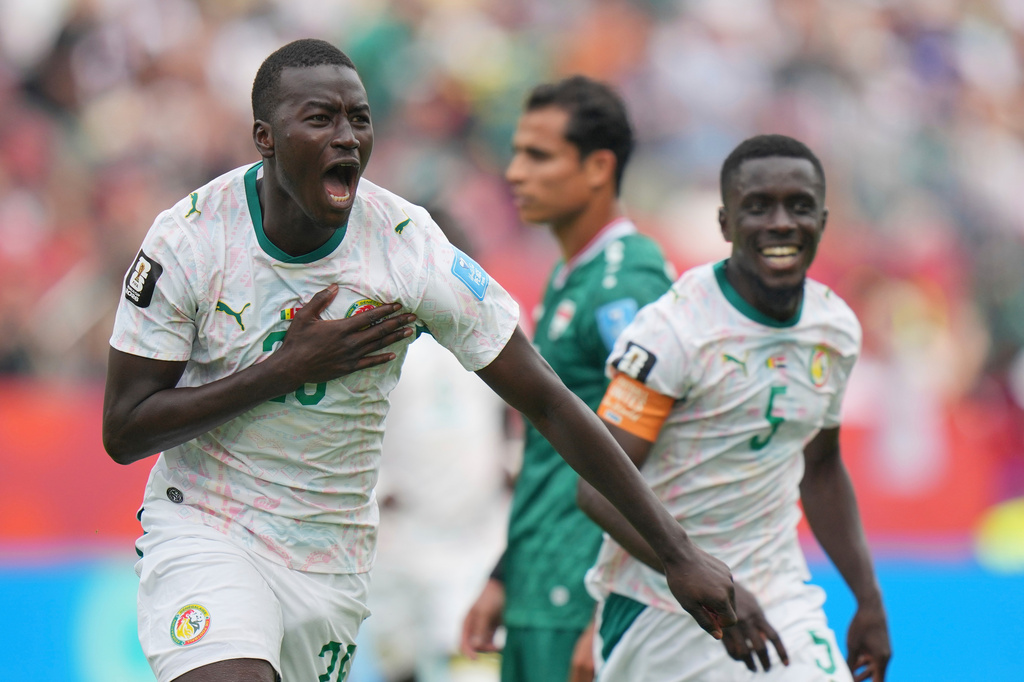 Senegal's Pape Gueye (26) celebrates their third goal during the World Cup Group I soccer match between Senegal and Iraq in Toronto, Friday, June 26, 2026. (AP Photo/Stephanie Scarbrough)